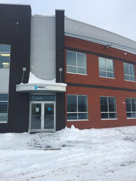Carminex building with Sepro logo